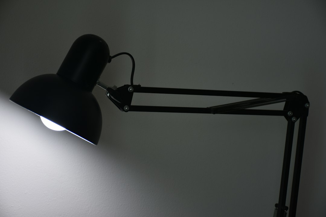 Photo matte black bohemian metal reading lamp